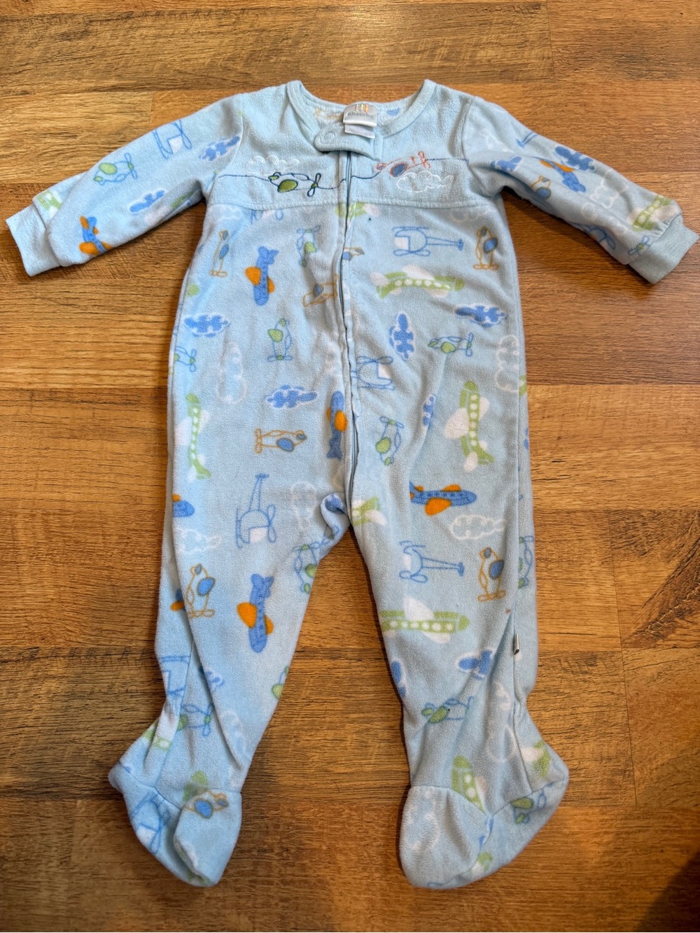 Absorba 6-9m footie sleeper zip up pajamas with planes and clouds.